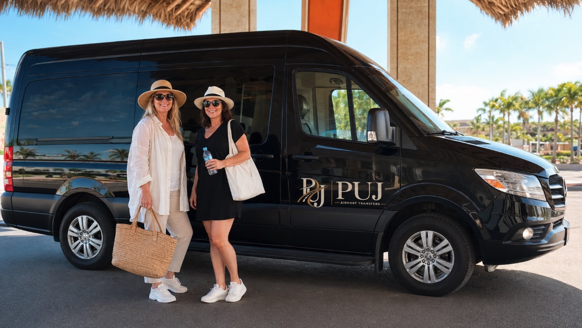 Private airport transfer van at Punta Cana with travelers beside the vehicle
